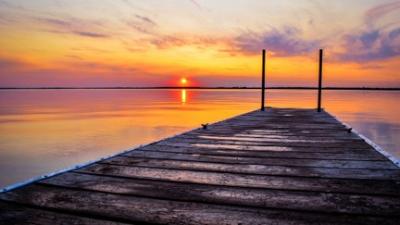 Dock on lake sunset