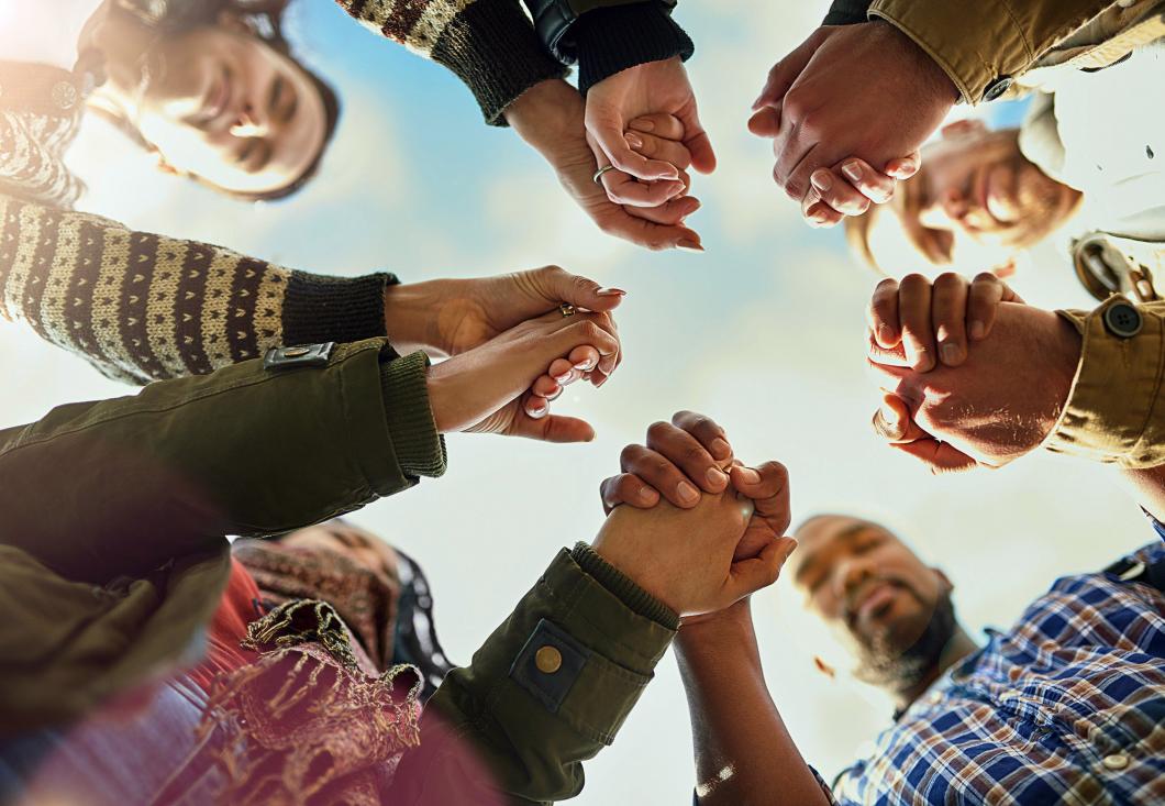 People holding hands in a circle