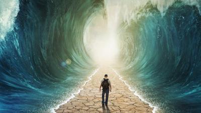 Man walking through sea